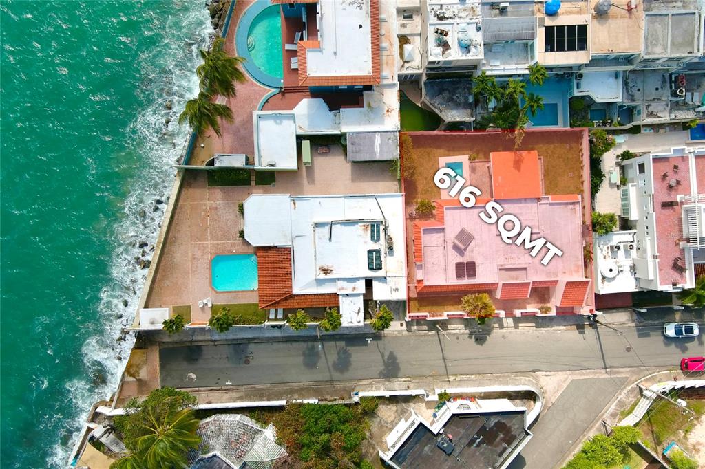 This aerial view shows two adjacent coastal properties with swimming pools and red-tiled roofs — 5 HISTELA, PUNTA LAS MARIAS, SAN JUAN, PR