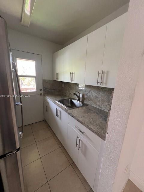 An open stainless steel refrigerator with an empty interior and wire shelving — 3901 SW 78th Ct # 219, Miami FL 33155, MIAMI, FL