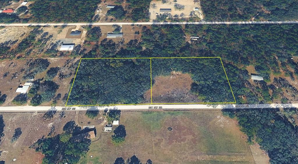 An aerial view shows two adjacent, wooded rectangular lots bordering a paved road — 11751 SE 57TH STREET, MORRISTON, FL