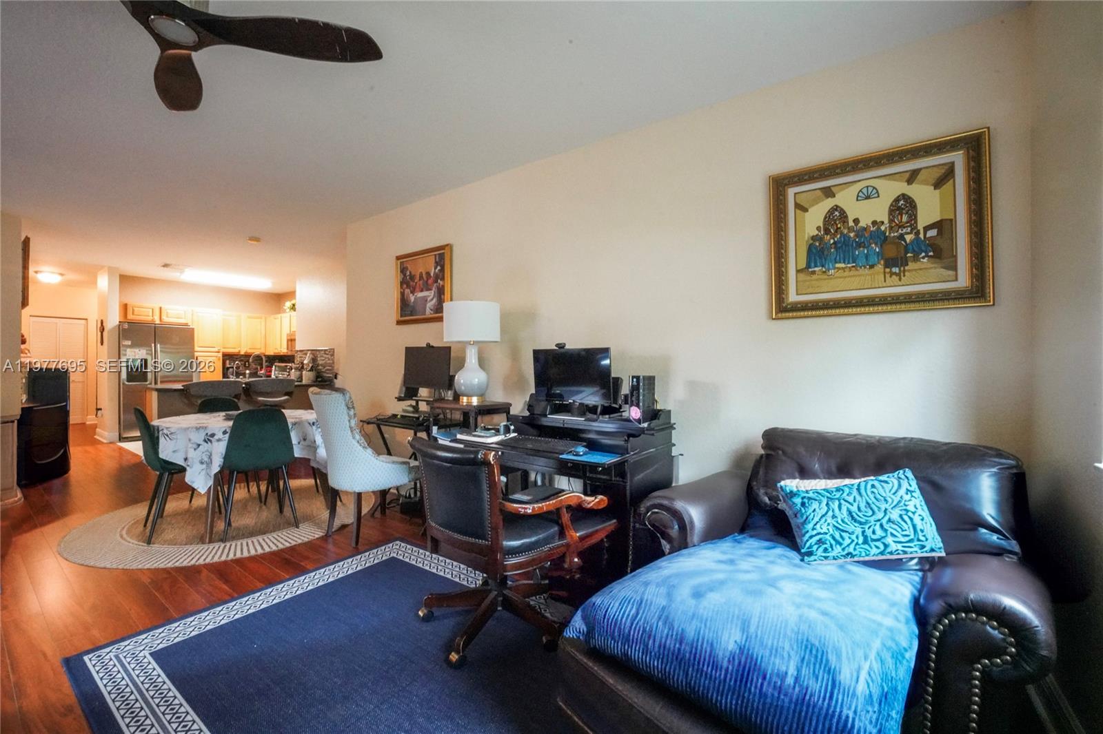 A living room with a desk, a leather chaise lounge, and an adjacent dining area — 3335 Palomino Dr # 3, Davie FL 33024, DAVIE, FL