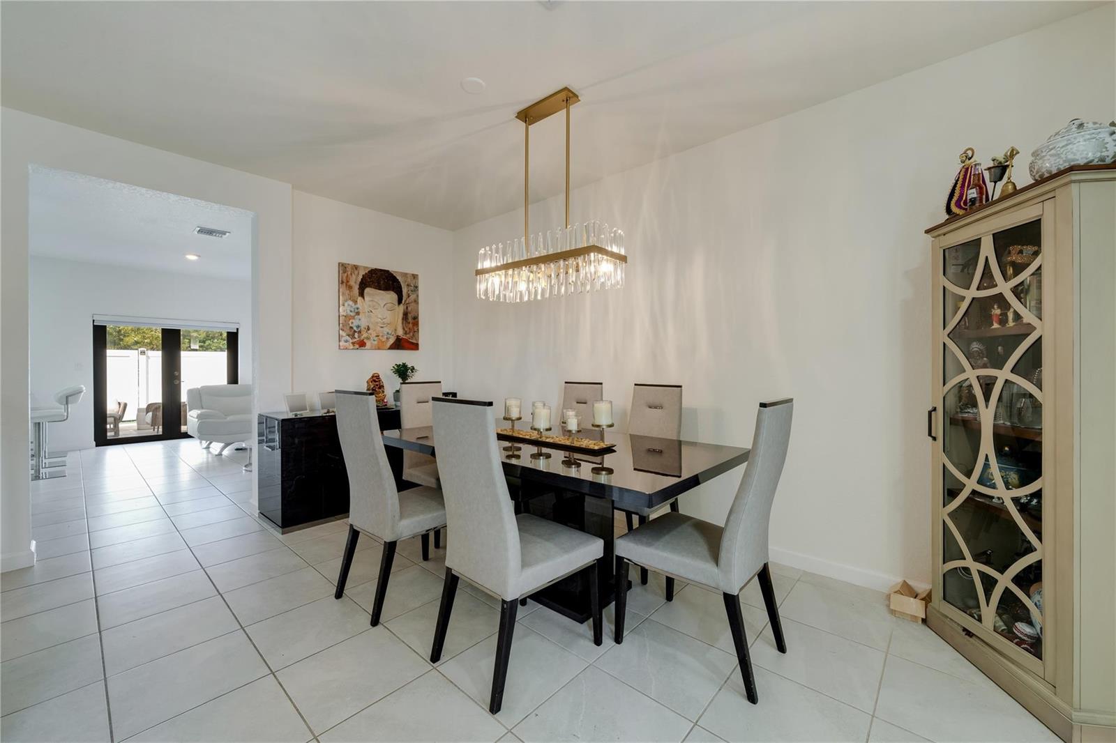 A row of three two-story townhouses features stucco walls, stone accents, and covered front entrances — 11392 W 34th Way, Hialeah FL 33018, HIALEAH, FL