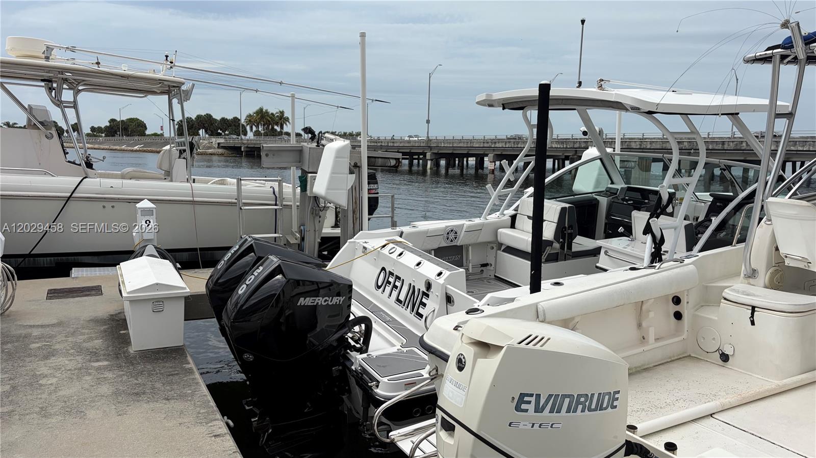 Two boats are docked at a concrete pier near a bridge — 150 SE 25th Rd, Miami FL 33131, MIAMI, FL