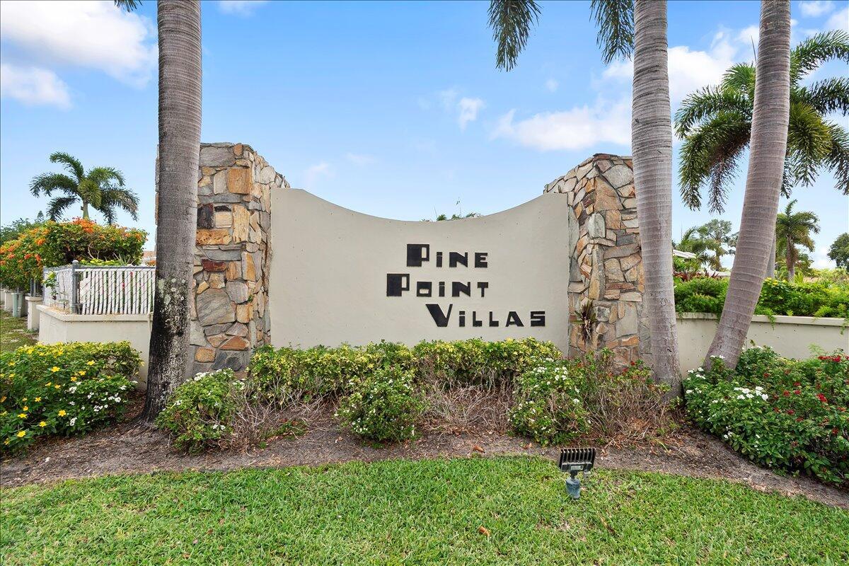 A stone and stucco monument sign for Pine Point Villas stands among palm trees — 3311 Valley Road # D, Boynton Beach FL 33435, BOYNTON BEACH, FL