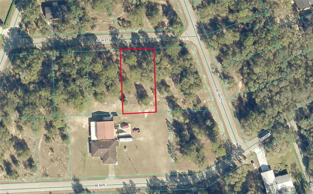This is an aerial map showing a vacant rectangular lot outlined in red — TBD SE 59TH STREET, OCKLAWAHA, FL
