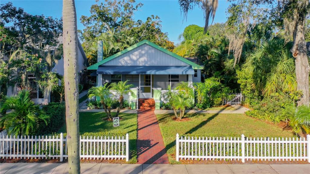 A single-story house with a front porch and a white picket fence — 2758 10TH STREET N, ST PETERSBURG, FL