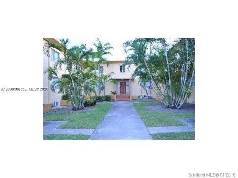 A two-story apartment building with a central walkway and palm trees in the front yard — 645 83rd St # 50, Miami Beach FL 33141, MIAMI BEACH, FL