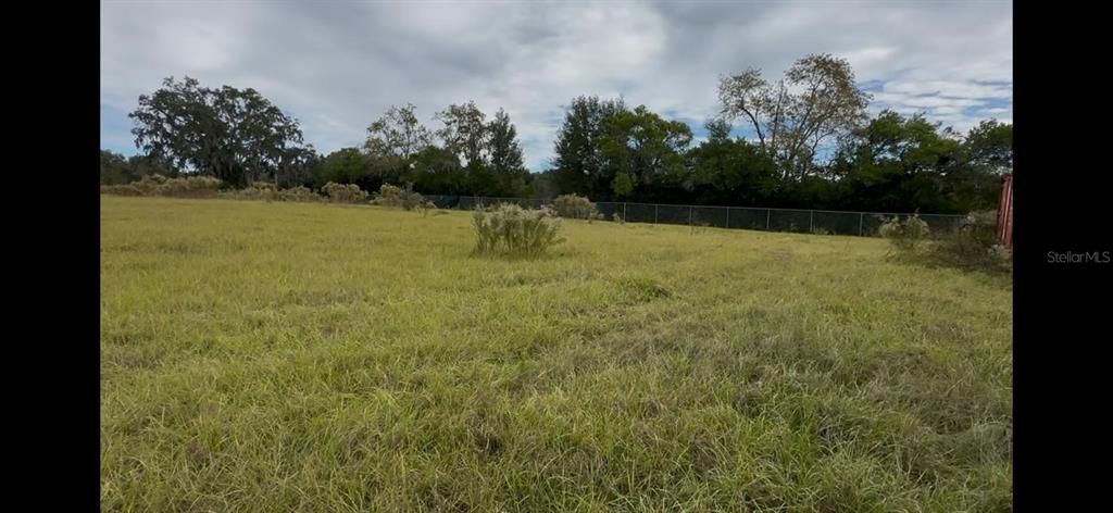 An aerial map shows a rectangular plot of land with its dimensions labeled in feet — 27360 CORTEZ BOULEVARD, BROOKSVILLE, FL
