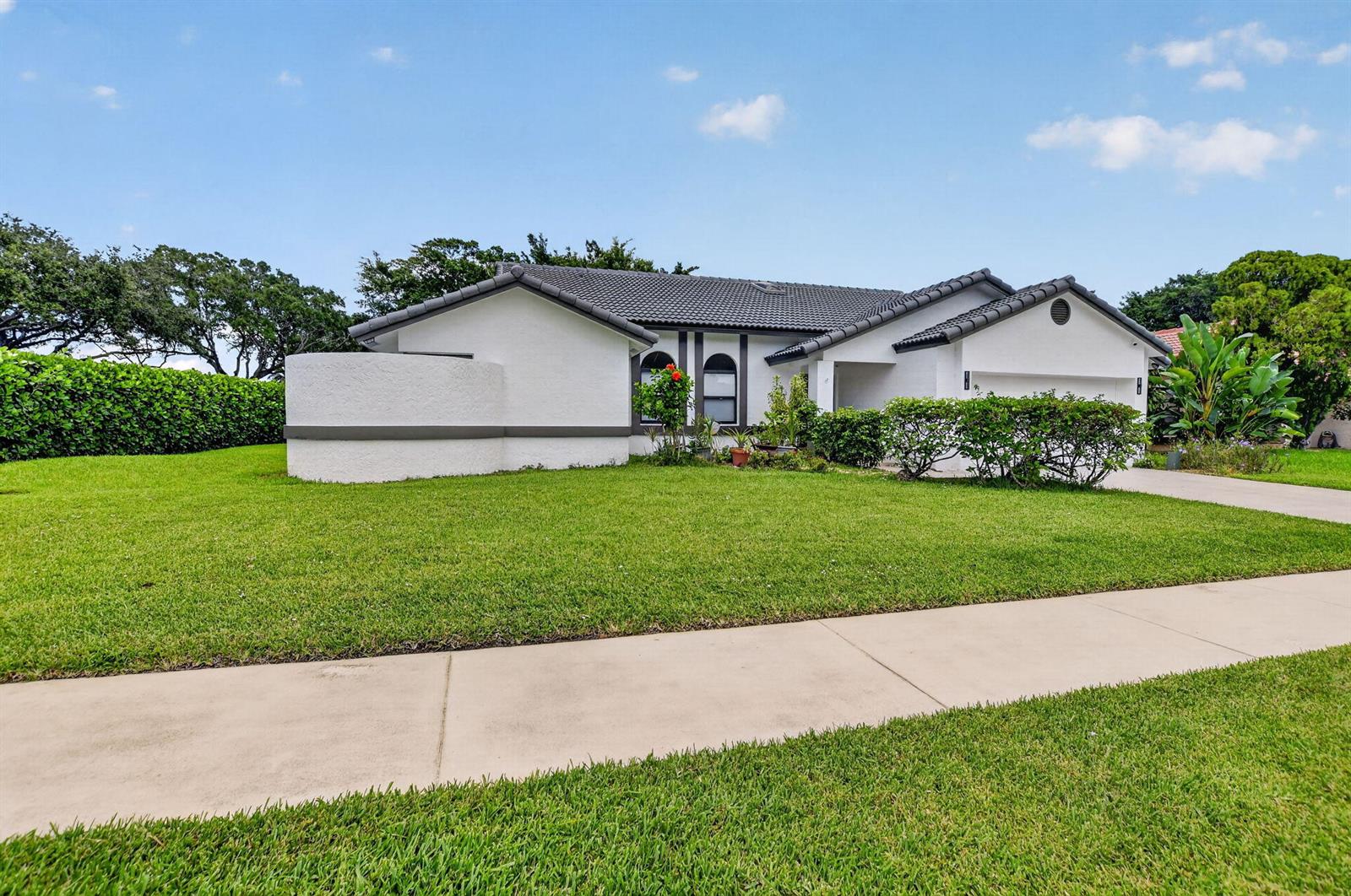 A single-story white house with a gray roof and a large front lawn — 19700 Sedgefield Terrace, Boca Raton FL 33498, BOCA RATON, FL