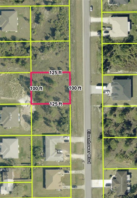 This is an aerial map showing a vacant rectangular lot highlighted in pink — 856 EISENHOWER BOULEVARD, LEHIGH ACRES, FL