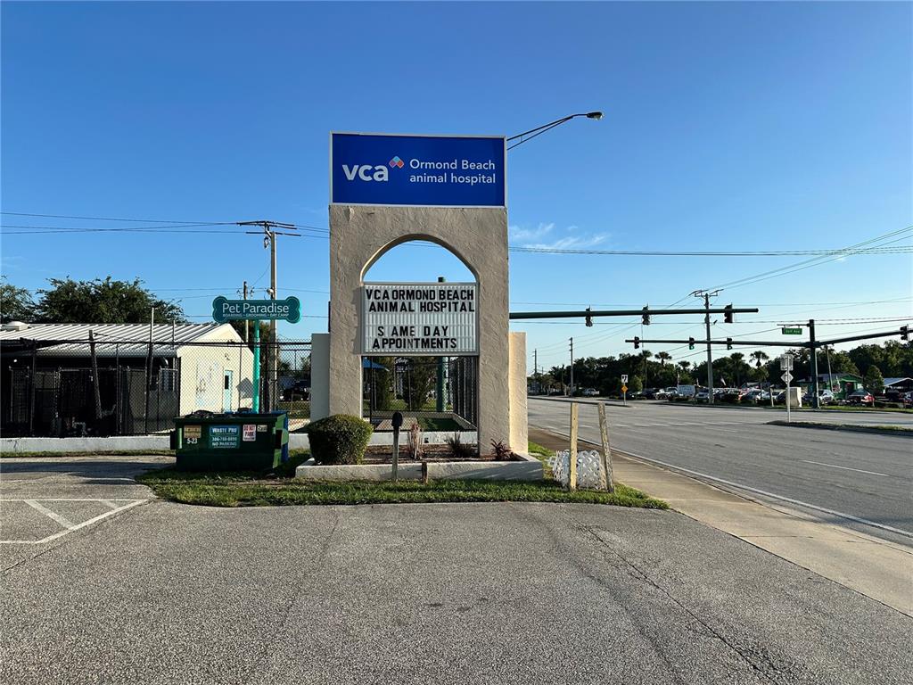 A VCA Animal Hospital sign stands in front of a building with a dumpster — 1104 S NOVA ROAD, ORMOND BEACH, FL