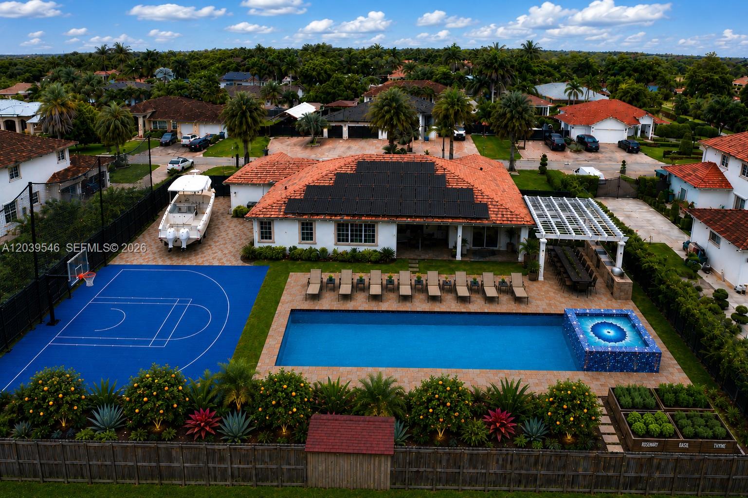 An aerial view of a house with a pool, basketball court, and solar panels — 12922 SW 221 St, Miami FL 33170, MIAMI, FL