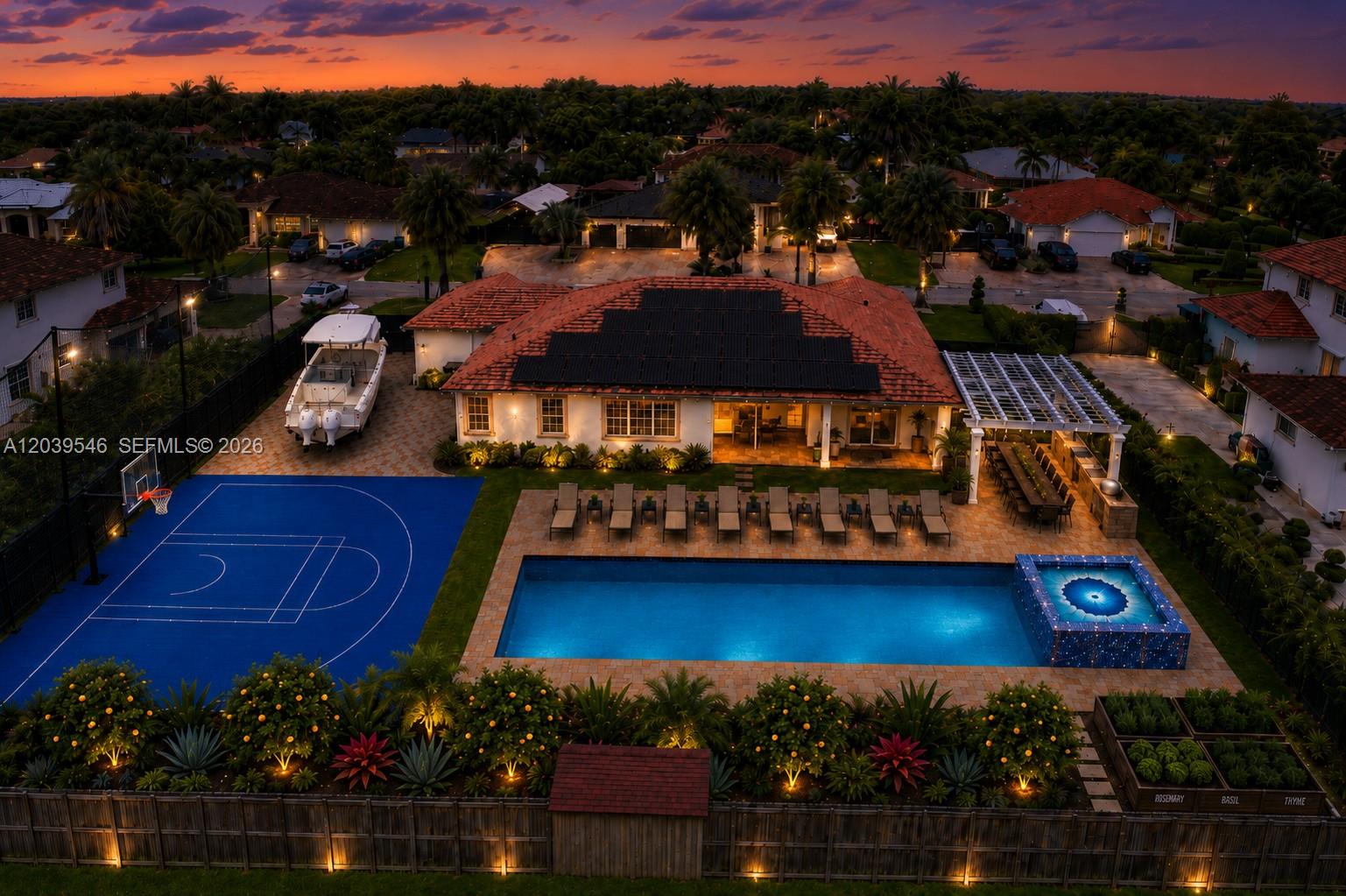 An aerial view of a house with a pool, basketball court, boat, and solar panels — 12922 SW 221 St, Miami FL 33170, MIAMI, FL