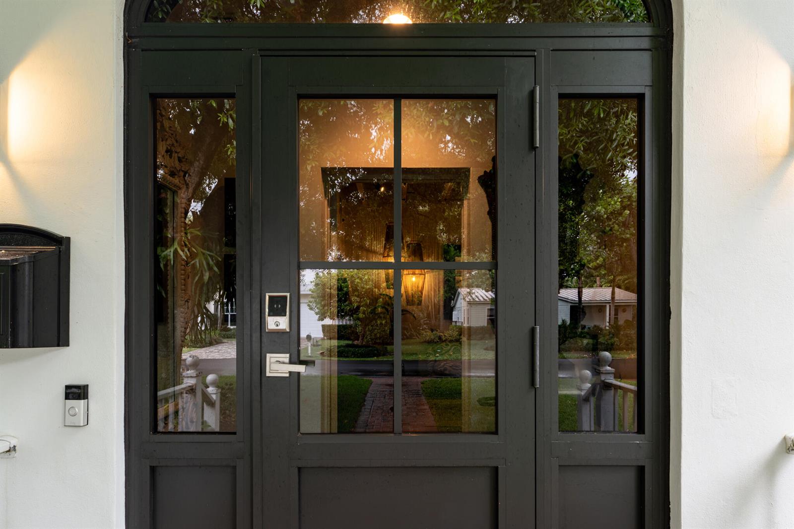 A dark-framed front door with glass panels and a smart lock on a white exterior — 302 NW 16th Street, Delray Beach FL 33444, DELRAY BEACH, FL