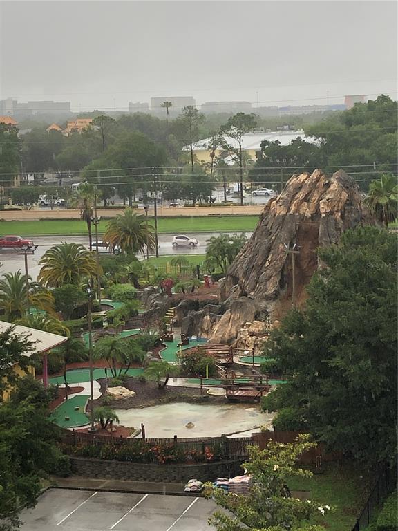 An elevated view of a miniature golf course with a large artificial rock formation — 13427 BLUE HERON BEACH DRIVE UNIT 2107, ORLANDO, FL