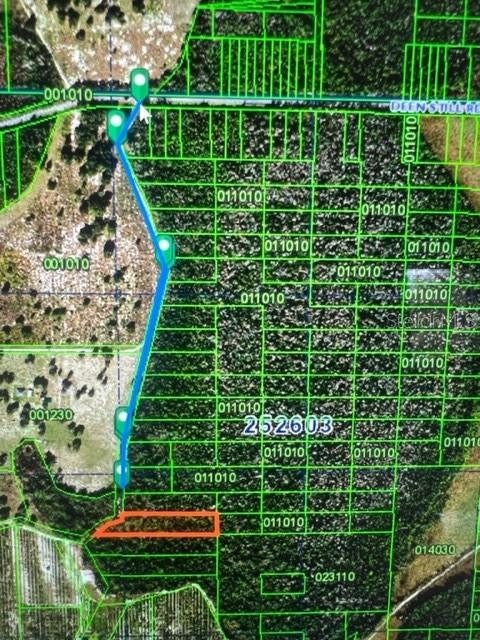 This is a map showing a property parcel highlighted in orange with an access path — DEEN STILL ROAD E, POLK CITY, FL