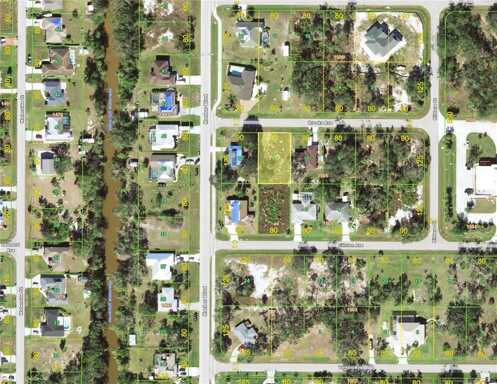 This is an aerial map showing residential lots and houses along several streets — 21447 BROOKS AVENUE, PORT CHARLOTTE, FL