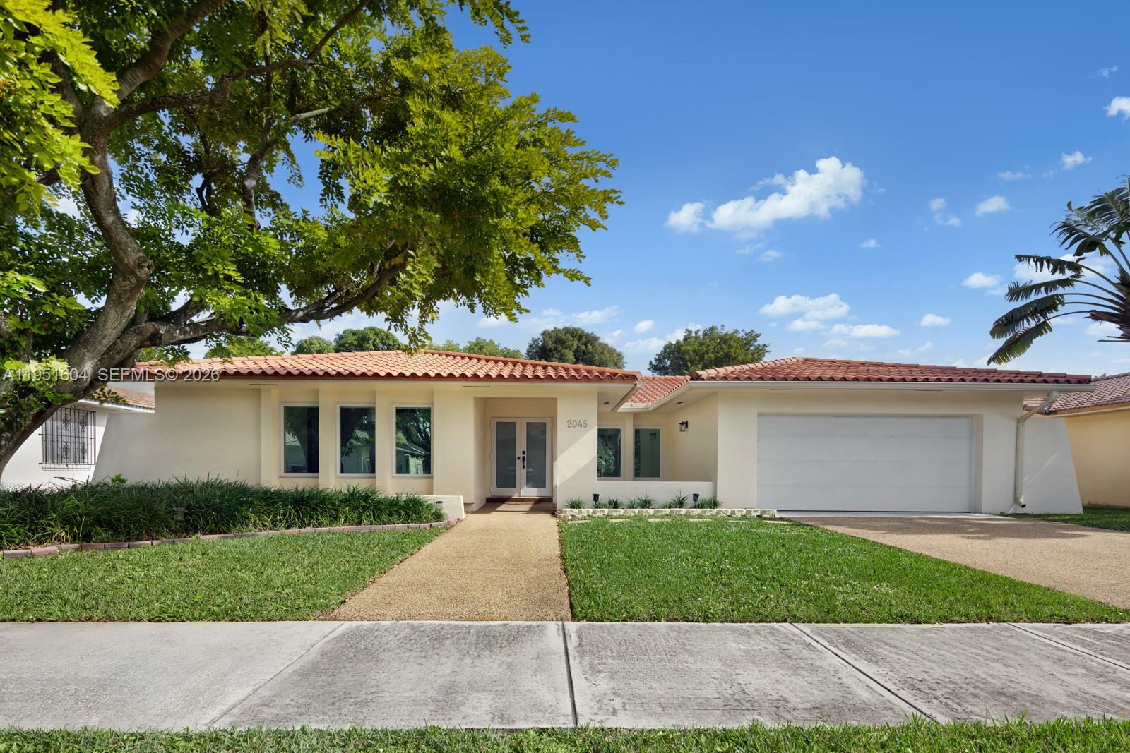 A single-story house with a white stucco exterior, terracotta roof, and a two-car garage — 2045 SW 125th Ct # 2045, Miami FL 33175, MIAMI, FL