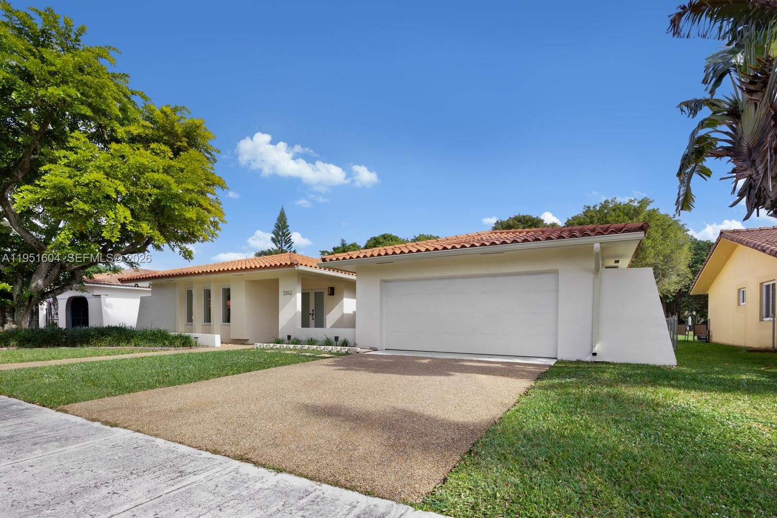 A single-story house with a white exterior, tile roof, and a two-car garage — 2045 SW 125th Ct # 2045, Miami FL 33175, MIAMI, FL