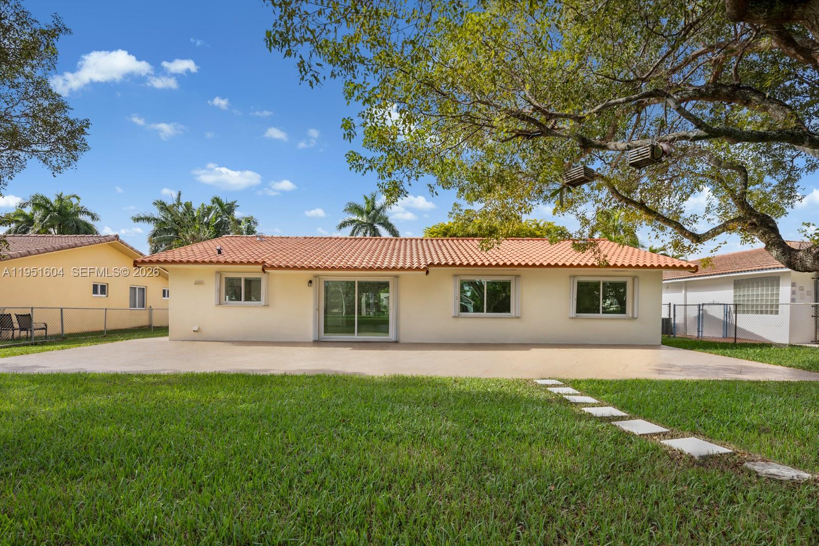 The exterior view shows the back of a single-story house with a tiled roof — 2045 SW 125th Ct # 2045, Miami FL 33175, MIAMI, FL