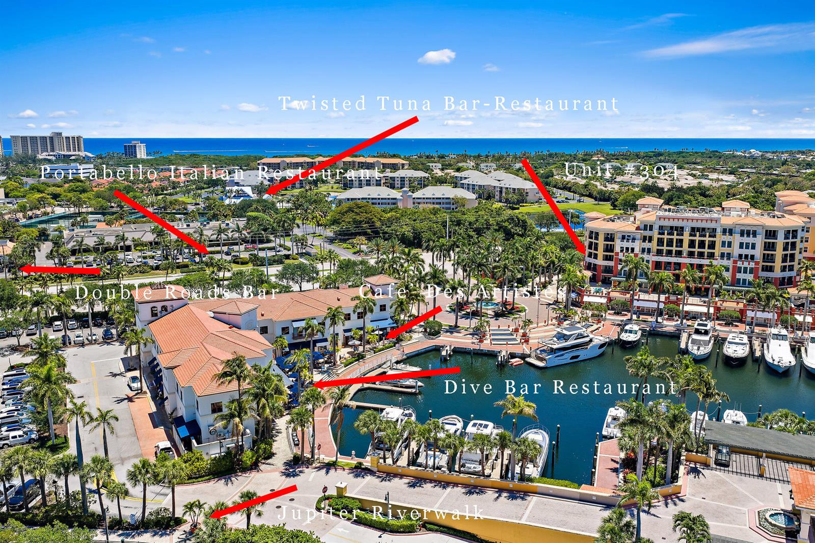 This aerial view shows a waterfront marina complex with restaurants, boats, and surrounding buildings — 400 S Us Highway 1 # 304, Jupiter FL 33477, JUPITER, FL