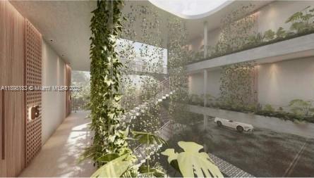 This architectural rendering shows a multi-level building interior with hanging plants and a central staircase — 555 NE 127th St, North Miami FL 33161, NORTH MIAMI, FL