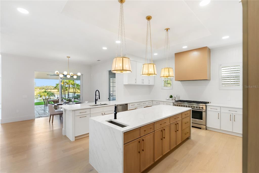 An aerial view of a two-story house with a tiled roof, pool, and patio — 11007 BIG BASS PLACE, BRADENTON, FL