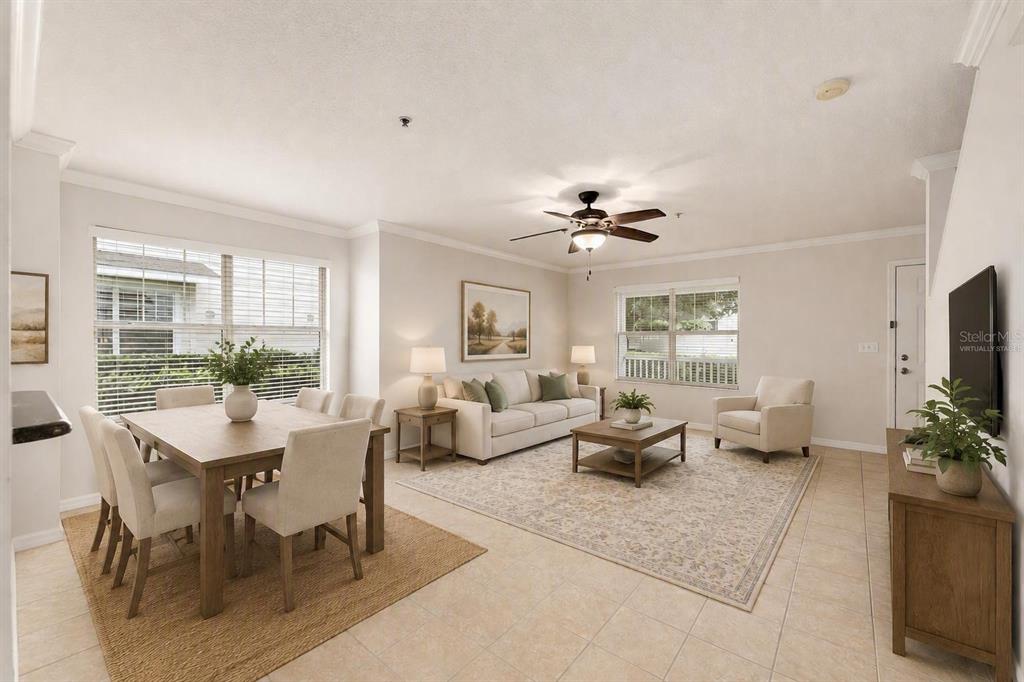 This virtually staged open-concept living and dining area features tile flooring and neutral walls — 4680 SW 48TH WAY UNIT 119, GAINESVILLE, FL
