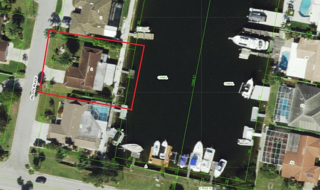 This is an aerial map showing a waterfront residential property highlighted in red — 5308 PILOTS PLACE, NEW PORT RICHEY, FL