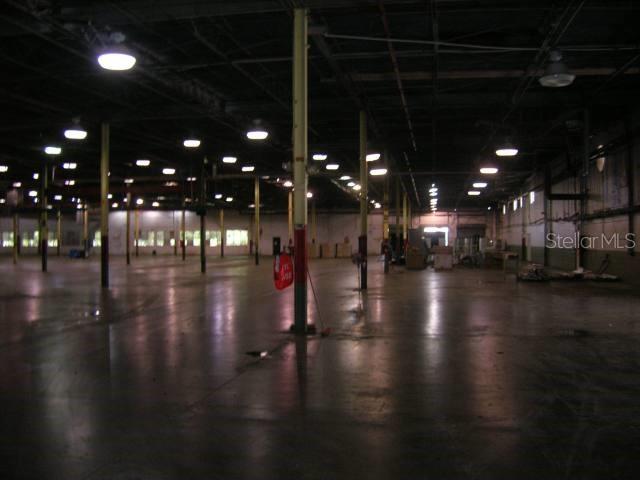 A large, open warehouse interior features concrete floors, exposed ceiling beams, and overhead lighting — Lot No. 9-B ISABELA INDUSTRIAL PARK PR 112 KM 2.3, ISABELA, PR