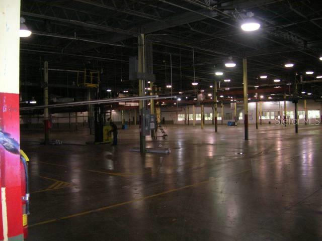 A large, open industrial warehouse space features a concrete floor and overhead lighting — Lot No. 9-B ISABELA INDUSTRIAL PARK PR 112 KM 2.3, ISABELA, PR