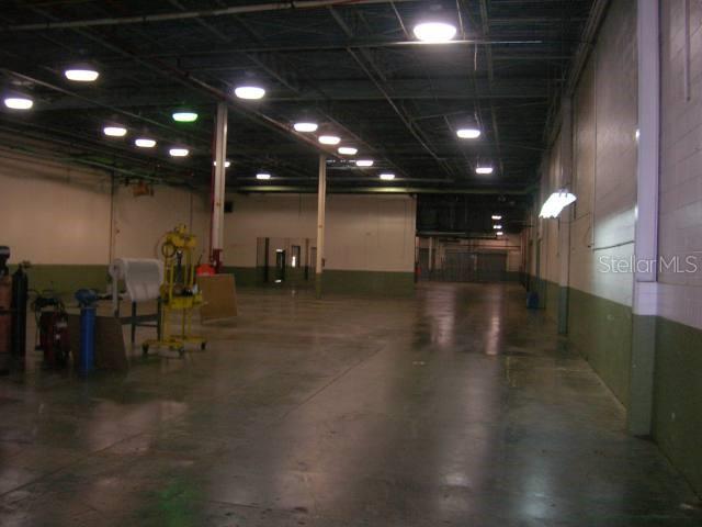An expansive, empty industrial warehouse space features a concrete floor and overhead lighting — Lot No. 9-B ISABELA INDUSTRIAL PARK PR 112 KM 2.3, ISABELA, PR