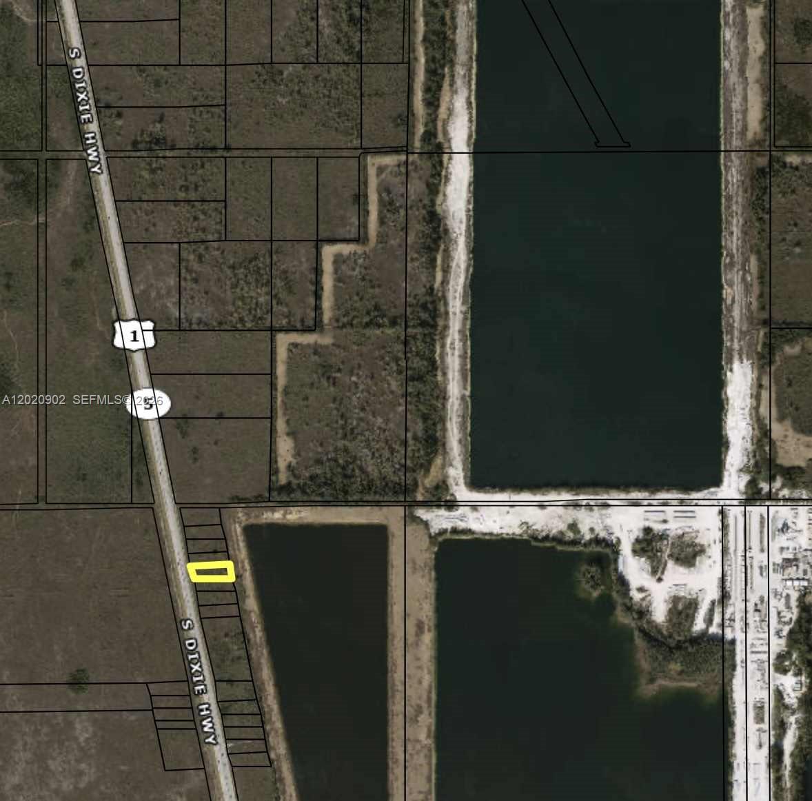 This is an aerial map showing a highlighted parcel of land along a highway — US1, Florida City FL 33034, FLORIDA CITY, FL