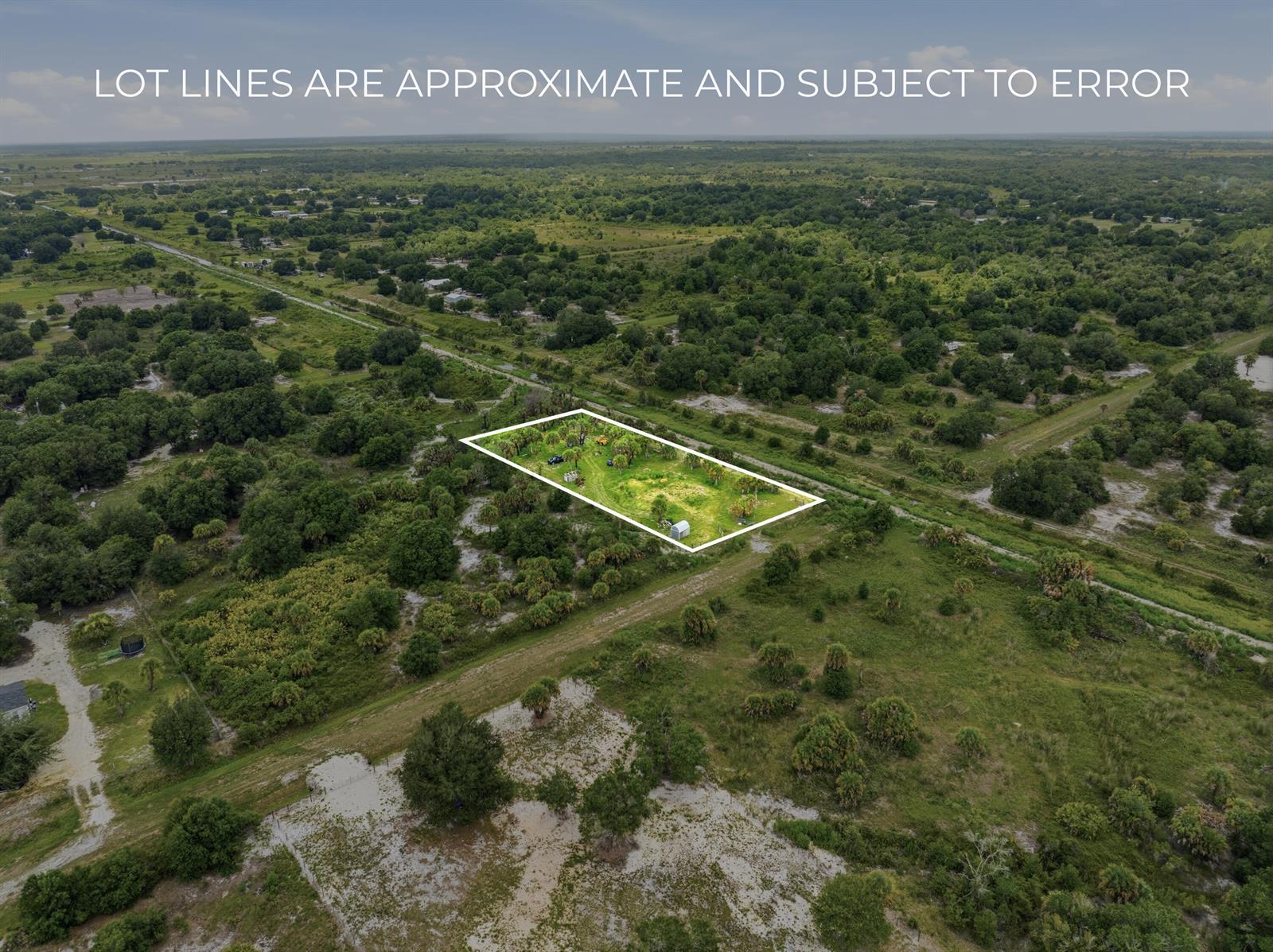An aerial view shows a rectangular plot of land outlined in white amidst rural vegetation — 19998 NW 270th Street, Okeechobee FL 34972, OKEECHOBEE, FL