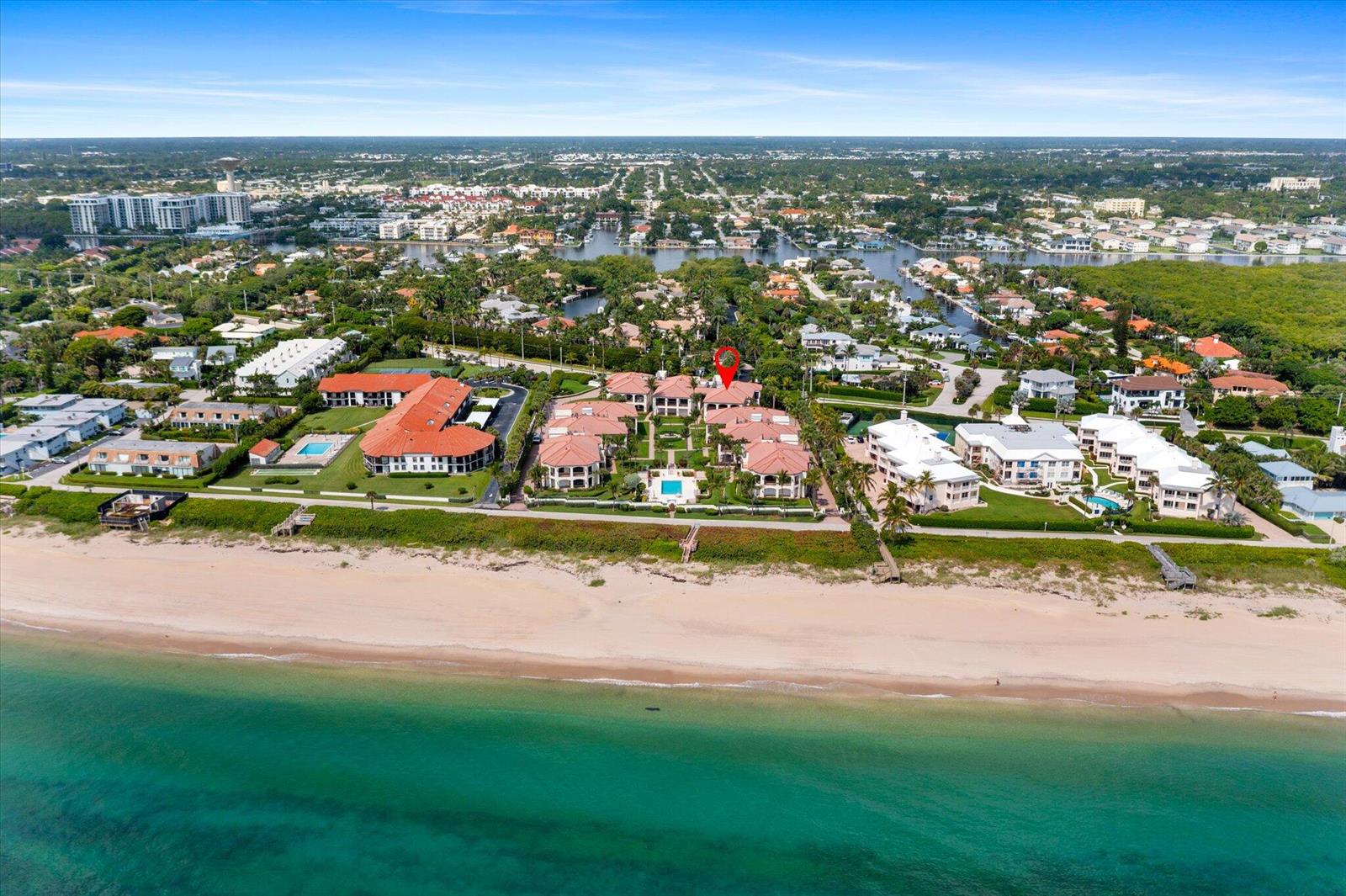 An aerial view of a beachfront residential complex with a red pin marking a unit — 5841 N Ocean Boulevard # F2, Ocean Ridge FL 33435, OCEAN RIDGE, FL