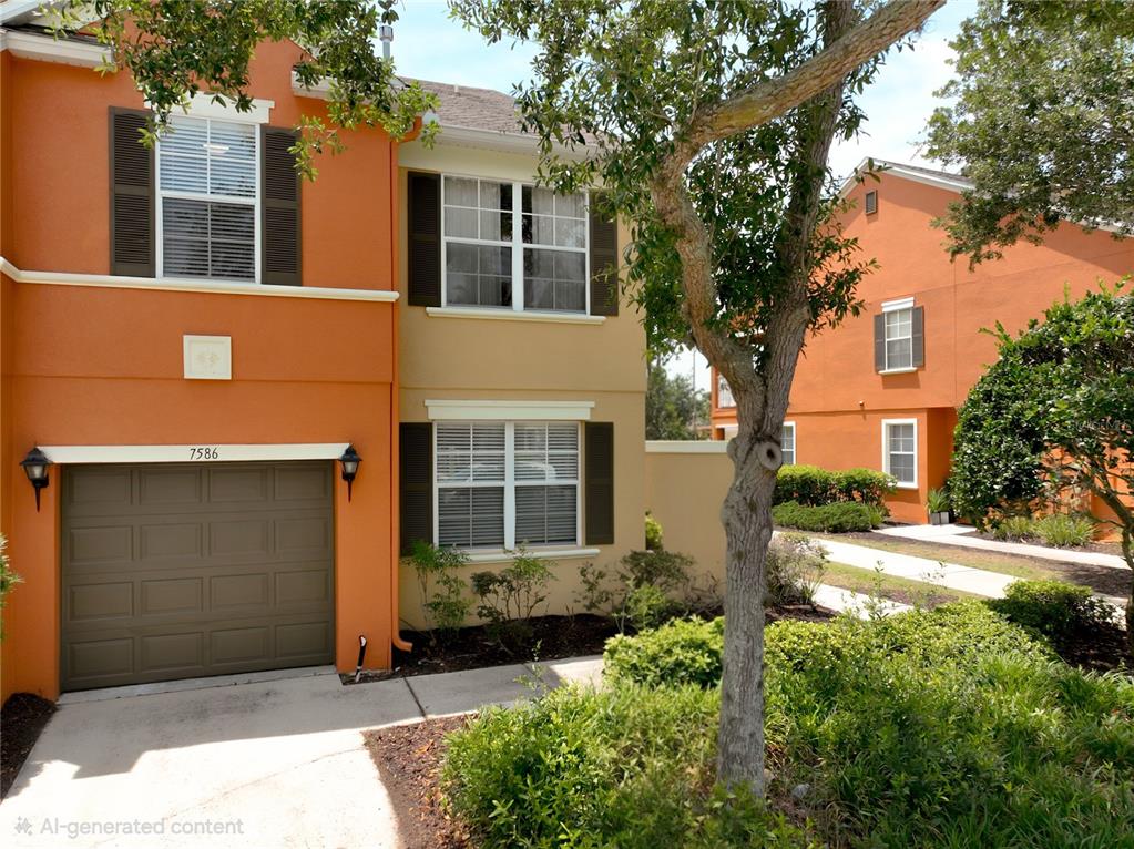 A two-story orange townhouse with a brown garage door and dark shutters — 7586 ASSEMBLY LANE, REUNION, FL