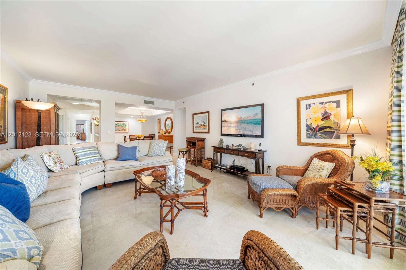 A living room features a large sectional sofa, wicker armchairs, and a glass-topped coffee table — 791 Crandon Blvd # 404, Key Biscayne FL 33149, KEY BISCAYNE, FL