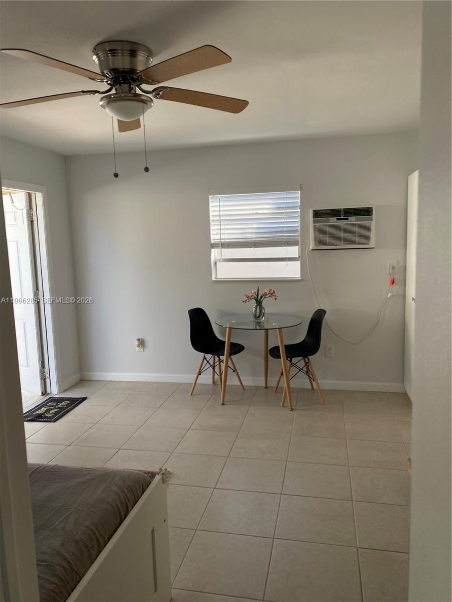 A small room features a dining table, two chairs, a ceiling fan, and tiled floors — 2481 SW 11 st, Miami FL 33135, MIAMI, FL