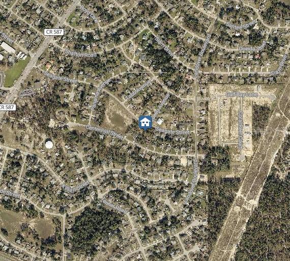 This is an aerial map view of a residential neighborhood with a highlighted property location — LOT 23 SEAGATE STREET, SPRING HILL, FL