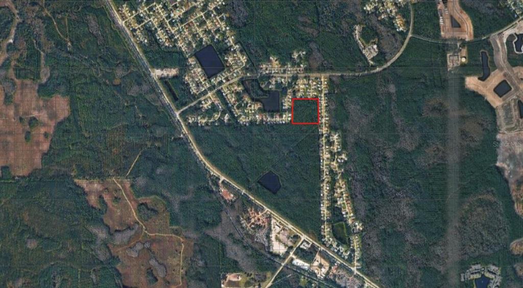 An aerial map view shows a square plot of land outlined in red — KATHLEEN TRAIL, PALM COAST, FL