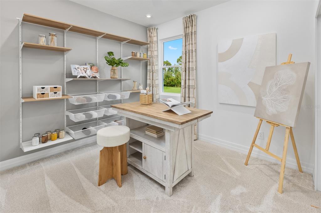 An empty room with light wood-look flooring, recessed lighting, two windows, and sliding glass doors — 12134 MEDITATION TRAIL, VENICE, FL