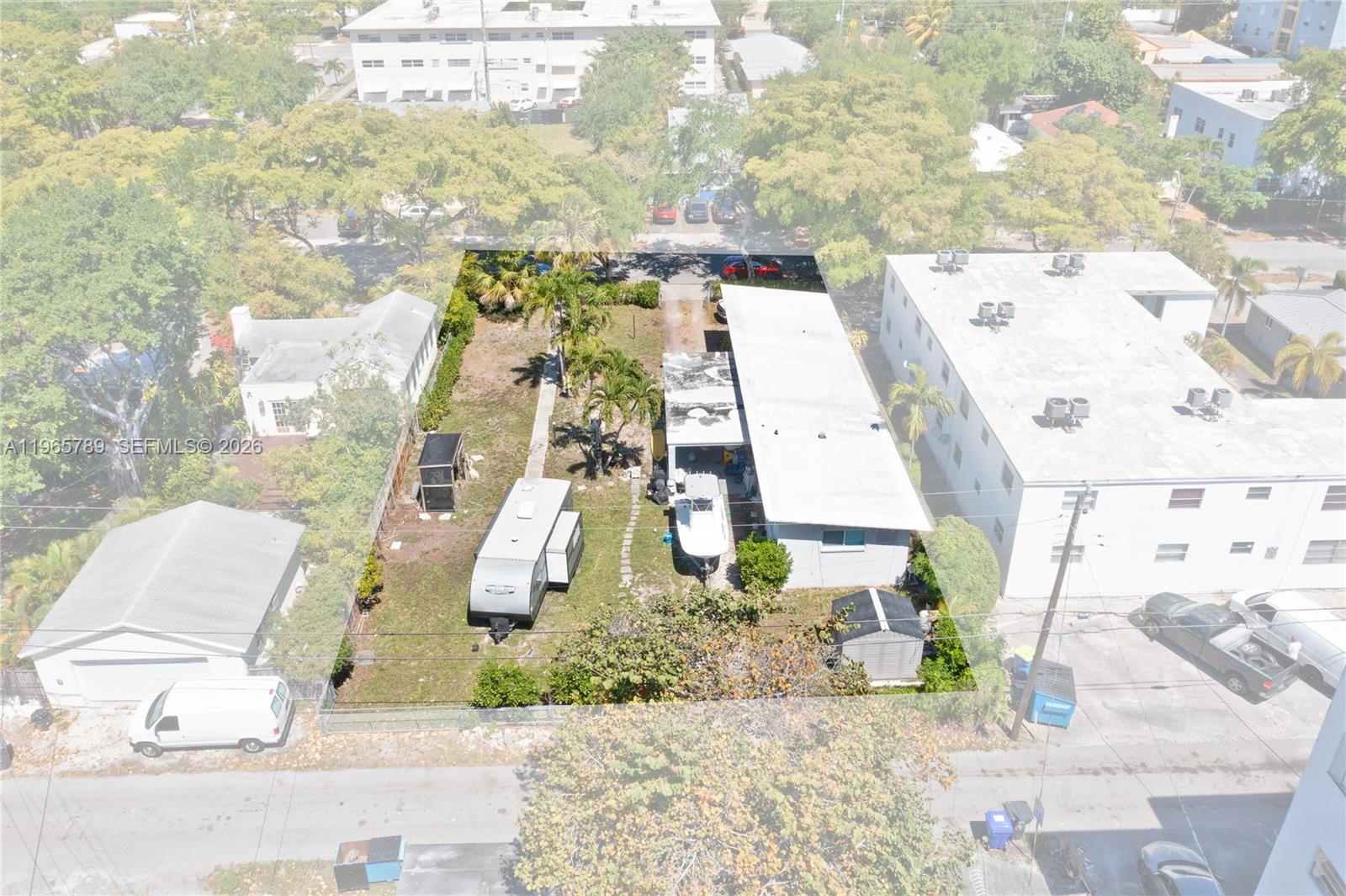 An aerial view shows a rectangular lot with a house, a trailer, and a boat — 1946 Madison St, Hollywood FL 33020, HOLLYWOOD, FL