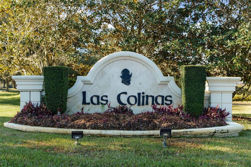 A single-story house with a tile roof, arched entryway, and a manicured lawn — 9939 SANTA BARBARA COURT, HOWEY IN THE HILLS, FL