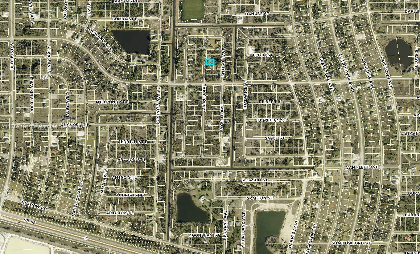 This is an aerial map showing a residential neighborhood with streets and property lot lines — 941 Garnet Ave, Lehigh Acres FL 33974, LEHIGH ACRES, FL