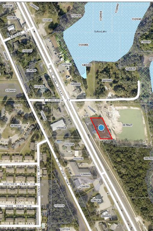 This is a map showing a highlighted parcel of land located along a highway — S US HIGHWAY 27/441, LADY LAKE, FL