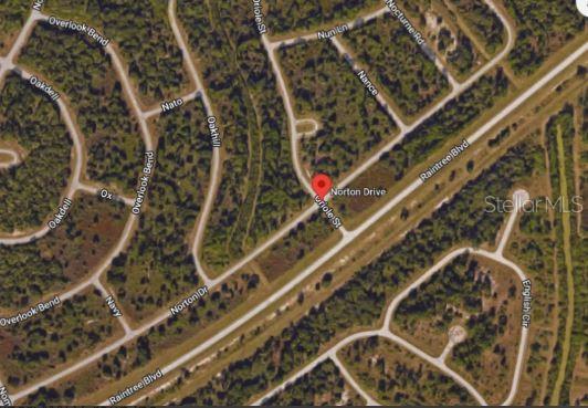 This is a satellite map view showing residential streets and a red location pin — NORTON DRIVE, NORTH PORT, FL