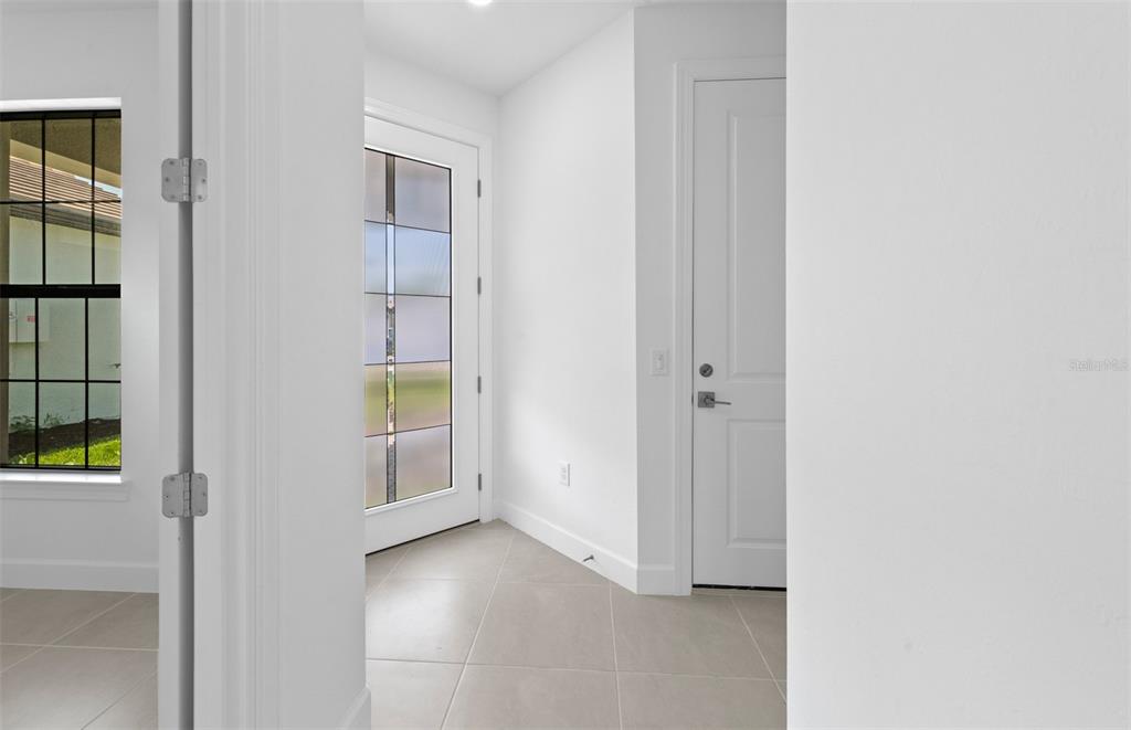 This is a floor plan for a single-story home with a two-car garage — 5834 TALON PRESERVE DRIVE, NOKOMIS, FL