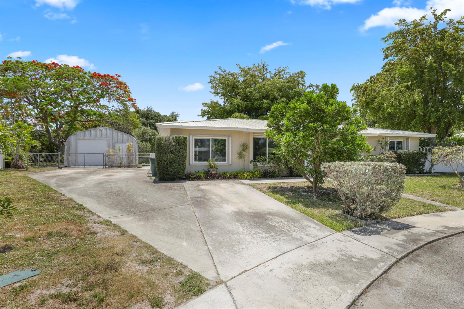 A single-story house with a concrete driveway and a detached metal garage — 1720 SW 10th Street, Boca Raton FL 33486, BOCA RATON, FL