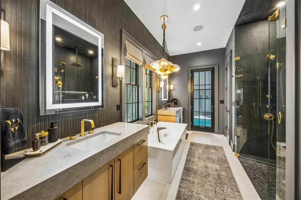 A modern bathroom features a double vanity, a freestanding tub, and a glass-enclosed shower — 52 Wallan Court, FL 32034, FL