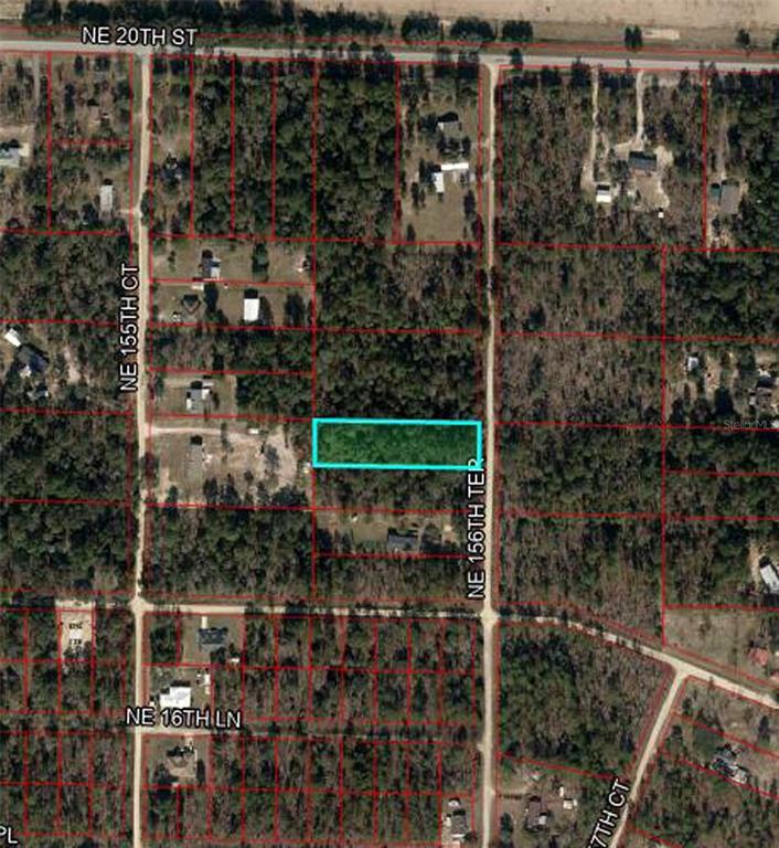 This is an aerial map showing a rectangular plot of land highlighted in blue — 1790 NE 156TH TERRACE, WILLISTON, FL