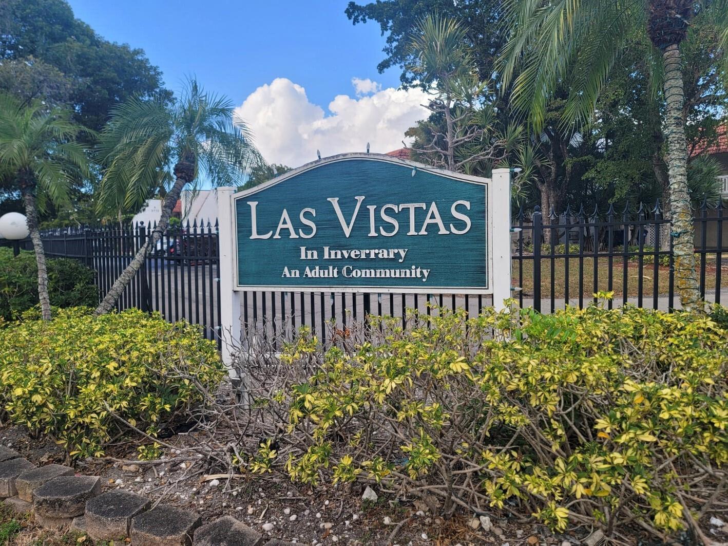 A sign for Las Vistas adult community stands behind a black metal fence and bushes — 3774 Inverrary Boulevard # P202, Lauderhill FL 33319, LAUDERHILL, FL